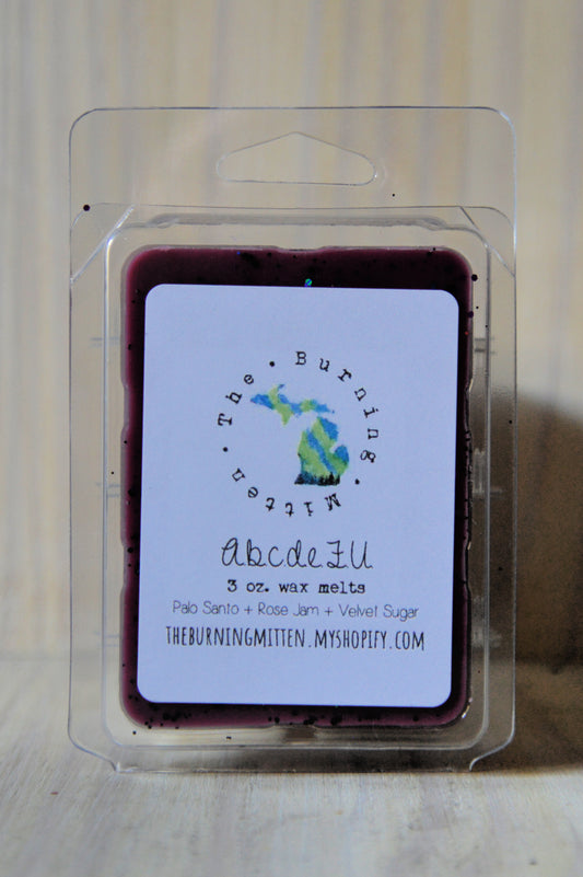 A.b.c.d.e.F.U. Clamshell (palo santo + rose jam + velvet sugar)